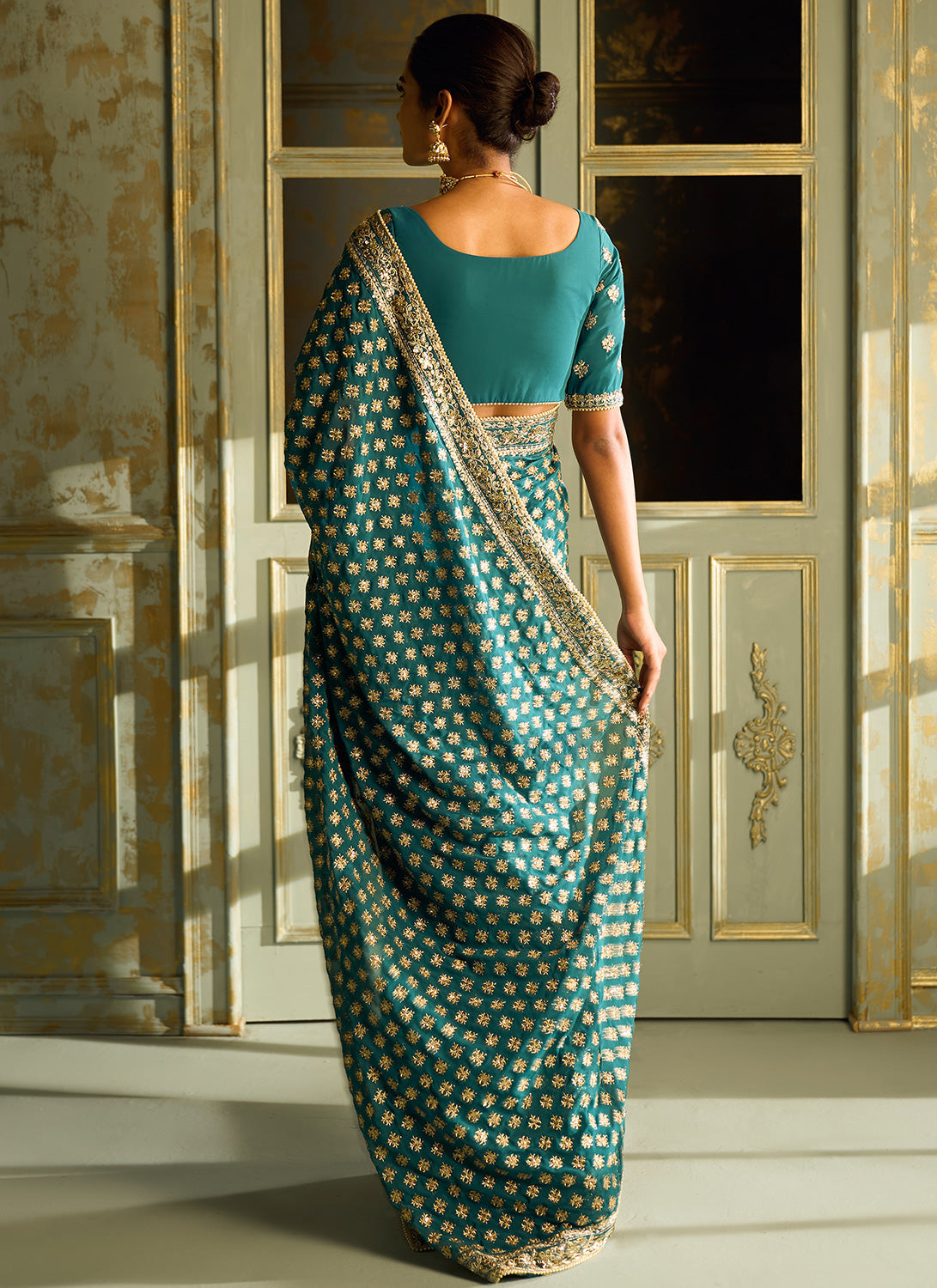 Teal Embroidered Georgette Saree
